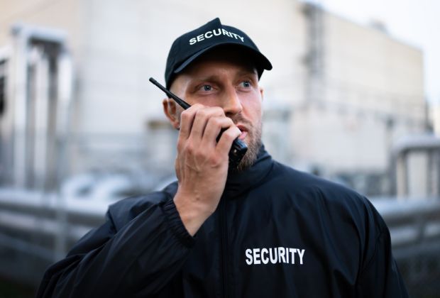 Security personnel communicating via radio